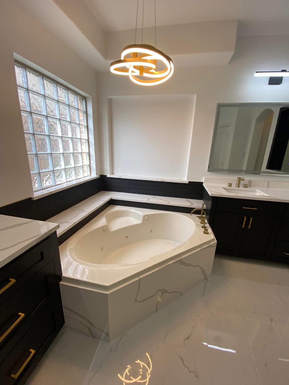 Luxury master bath with jetted tub Modern bathroom with corner jetted tub and marble surrounds in a Katy TX master bath