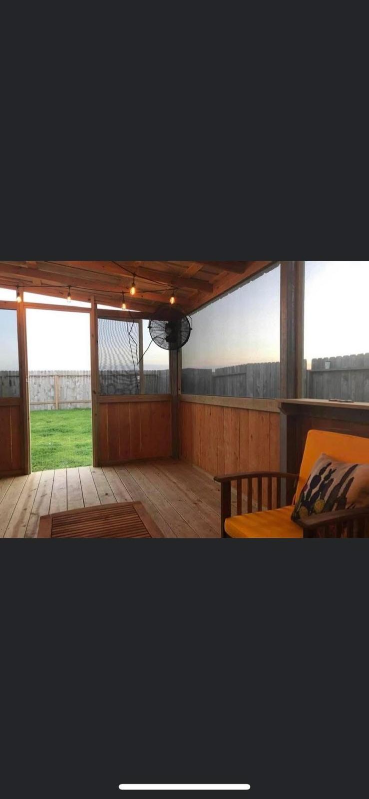 Screened cedar patio retreat Screened-in wooden porch and outdoor living space in a Fort Bend County TX home